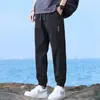 Pantalones casuales de seda de hielo de secado rápido para hombre 2025 nuevos pantalones deportivos transpirables para niños verano finos sueltos con puño
