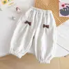 Calça de Inverno Feminina Moda Internet Veludo Plus 2026 Novo Estilo Infantil Versátil Doce Laço Tornozelo Quente Calça Longa
