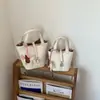 Bolso Bandolera Cruzado Fresco y Dulce para Mujer, Bolso Cubo de Nicho Estilo Coreano, Bolso de Mano Versátil para el Trabajo Nueva Moda 2026
