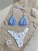 Traje de baño nuevo estilo europeo y americano 2026 con estampado, cordones, bikini sexy de tres piezas, trajes de baño, transfronterizo