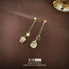 Pendientes de borla largos con estrellas distintivas de moda de Corea del Sur, pendientes de piedra de ojo de gato ligeros y elegantes de nicho para mujer