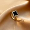 Versión coreana del anillo giratorio de trébol de cuatro hojas de diseño nicho para mujer con circonita engastada en fritilaria geométrica, suministro al por mayor
