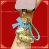 Llavero Dorado con Oro Puro, Simbolizando Riqueza Instantánea, Colgante para Teléfono, Colgante para Bolso con Certificado, Venta al por Mayor de Accesorios