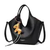 Elegante y estiloso bolso de mano con colgante de poni para mujer, nuevo modelo 2026, adecuado para ir al trabajo, bolso de hombro moderno y versátil, bolso cruzado
