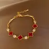 Pulsera Trenzada Hebilla de Herradura Redonda de Circonita Roja Europea y Americana Diseño de Nicho Pulsera Exquisita de Gama Alta para Mujer