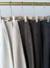 Pantalones de lana y acetato de pierna curva - adelgazantes, de cintura alta, casuales y con un diseño deconstruido
