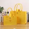Bolsas de fieltro para compras transfronterizas, en stock, bolsas de hombro grandes de alta capacidad, bolsas de regalo publicitarias promocionales y juegos de regalo navideños