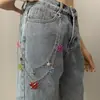 Moda de joyería transfronteriza europea y americana, color versátil, colgante de mariposa acrílica, cadena para la cintura, cadena corporal de aleación de estrella de cinco puntas para mujer