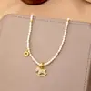 Nuevo Estilo "Caballo de Dinero" Collar de Perlas Shijia, Moda de Lujo Ligero, Diseño de Nicho, Sensación de Alta Gama, Cadena Versátil para Suéter