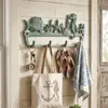 Artesanía de hierro fundido simple, nostálgica y de estilo retro con diseños de animales marinos - un colgante de pared decorativo para balcones, patios y villas