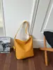 Bolsa de balde de nicho transfronteiriça de alta qualidade para mulheres, nova, textura tecida retrô, bolsa de ombro único de axila, bolsa de mão para trabalho e trajeto