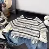 Camiseta de manga larga para niño, nueva colección de otoño 2026, top a rayas de corte holgado para niños, estilo de dos piezas, camiseta interior para bebé, ropa para niños