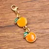 Varios accesorios de joyería personalizados de aleación transfronterizos europeos y americanos con dijes de frutas, llaveros de doble plátano, sandía y fresa