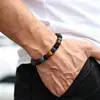 Venta al por mayor de fábrica de pulseras de cristal, pulseras vintage de ónix negro natural y ojo de tigre, pulseras de cuentas y pulseras de cristal transfronterizas europeas y americanas
