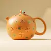 Tetera de Arcilla Dorada Arena Morada Modelo Nuevo 2026 Separación Té-Agua Tetera Individual Tetera Xishi Set de Té Kung Fu de Uso Doméstico de Gama Alta