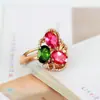 Anillo de imitación de turmalina roja y verde natural con hermosa abertura y incrustaciones de piedras preciosas de colores.