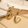 Pendientes de aro de acero inoxidable con explosiones transfronterizas para mujer, pendientes de anillo hidráulico redondo de temperamento de moda, venta al por mayor de fábrica de pendientes