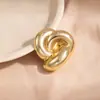 Broche Retorcido de Metal Brillante de Alta Gama Estilo Europeo y Americano Diseño de Nicho Nuevo Accesorios para Traje