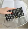 Cartera pequeña de estilo retro europeo y americano, diseño nuevo con cierre de anilla en D, adecuada para estudiantes, multifuncional, gran capacidad, para comercio exterior y ventas transfronterizas, tarjetero y monedero