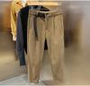Outono e inverno calças de veludo dos homens estilo coreano solto em linha reta quente veludo cropped skinny calças casuais homens