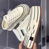 Sapatos de lona pretos de sola grossa de nicho para mendigo femininos 2025 primavera e outono novos sapatos plataforma de sola grossa versáteis casuais tênis de skate