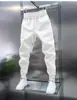 Calça Jogger Masculina Nova Primavera e Outono 2024, Cor Sólida com Cordão, Casual Esportiva, Caimento Solto, Versátil, Calça Longa Engrossada