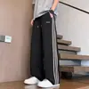Pantalones casuales de calle estilo americano para hombre, nuevos pantalones rayados fluidos, pantalones deportivos anchos casuales holgados de secado rápido para hombre