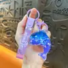 Llavero creativo de concha pequeña con aceite, lindo colgante pequeño de arena movediza líquida, accesorios para bolso, pequeño colgante de regalo, venta al por mayor