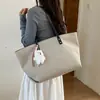 Bolso grande de mujer transfronterizo, nuevo bolso de hombro de moda otoño 2026, bolso tote texturizado casual para commuting de nicho