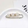 Broche de cintura transfronterizo, broche de perlas, pasador para fijar la línea de la cintura de la ropa, herramienta para ceñir la cintura, hebilla de cierre para la cintura anti-exposición