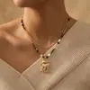 Nuevo Collar con Colgante de Flor de Ciruelo China, Ojo de Tigre y Ciervo, Lujo Ligero, Diseño de Nicho, Cordón Hecho a Mano, Accesorio de Moda Versátil para Mujeres