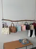 2026 Nova Tendência Simples Moda Bolsa de Ombro Único Feminina Grande Capacidade Manual Transversal Versátil para o Dia a Dia Bolsa Tote