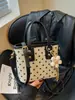 Bolsa feminina de alta qualidade transfronteiriça 2026 nova moda tendência primavera-verão requintada super popular bolsa de ombro transversal tipo balde