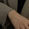Pulsera de cadena de serpiente redonda simple japonesa y coreana acero inoxidable chapado en oro cuerda para la mano joyería de moda para hombres y mujeres pulsera fina venta al por mayor