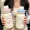Taza aislada linda con temática de gato y compartimento para té, con cordón portátil, hecha de acero inoxidable 316, adecuada para estudiantes, y disponible para venta al por mayor y pedidos personalizados.