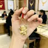 Hilo rojo para el Año de la Oveja, amuleto de dinero, colgante de cadena para teléfono de ovejita dorada, regalo promocional, pequeño adorno de oveja del zodíaco, venta al por mayor