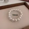 Venta al por mayor transfronteriza de pulseras con cuentas de perlas Shijia, pulseras de moda de lujo ligero estilo francés, accesorios de mano versátiles elegantes de lujo ligero para uso diario