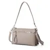 Bolso de Mano Simple Transfronterizo del Sudeste Asiático para Viajar al Trabajo, Bolso de Hombro con Múltiples Compartimentos, Bolso de Mano y Bolso Cruzado de Mujer con Cremallera de Color Sólido