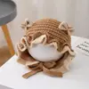 Bonitos y adorables gorros de otoño e invierno para niños, con diseño de poner, material de punto y una serie de dibujos animados, que brindan abrigo y protección para los oídos para bebés y niños pequeños.