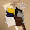 33105# Top sin mangas retro americano irregular de un solo hombro tachonado con pedrería y letra, sin espalda, con copas en el pecho, top elegante sin espalda para mujer
