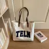 Bolsa tote de lona bordada com letras para mulheres, novo estilo 2026, grande capacidade, bolsa de ombro fashion, versátil para o trabalho e uso diário