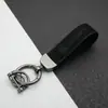 Colgante Llavero de Coche de Cuero Gamuzado Anillo de Resorte de Aleación de Zinc Cubierta de Llave Cadena de Llave con Logo de Coche Venta al por Mayor