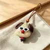 Encantador perrito peludo con la lengua fuera, llavero para bolso, colgante de dibujos animados natural, semillas de terapia de sonido curativas, popular en zonas escénicas, amuleto divertido y adorable