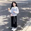 Conjunto de otoño estilo universitario para niñas: Chaleco dulce estilo coreano, camisa con cuello de muñeca y pantalones largos de retazos a cuadros retro - un conjunto de tres piezas
