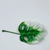 Plantas artificiales, follaje y helechos