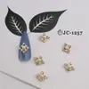Nuevo Colgante de Uñas de Celebridad Cibernética Aleación Diamante Estrella Luna Borla Ojo de Gato Mariposa Animal Decoración de Manicura Venta al por Mayor