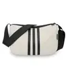 Bolso cuadrado pequeño de moda, versátil y enérgico, con tres rayas, bolso cruzado ligero, bolso tote con forma de albóndiga, hecho de tela Oxford deportiva