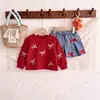 26 Colección de otoño transfronteriza europea y americana: sudadera de cuello redondo con pajarita para bebé y niño pequeño + falda de mezclilla A de lavado pesado, un conjunto de dos piezas