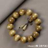 Pulseira Phoebe com aro dourado Folheto Phoebe Ébano Sombrio Conta de Buda Phoebe Zhen Nan Pulseira Masculina e Feminina Joias de Madeira Wen Play