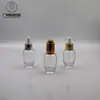 Venta caliente en stock botella de esencia de 30 ml botella de aceite esencial bomba gotero de presión galvanizada botella tipo huevo productos para el cuidado de la piel botella secundaria